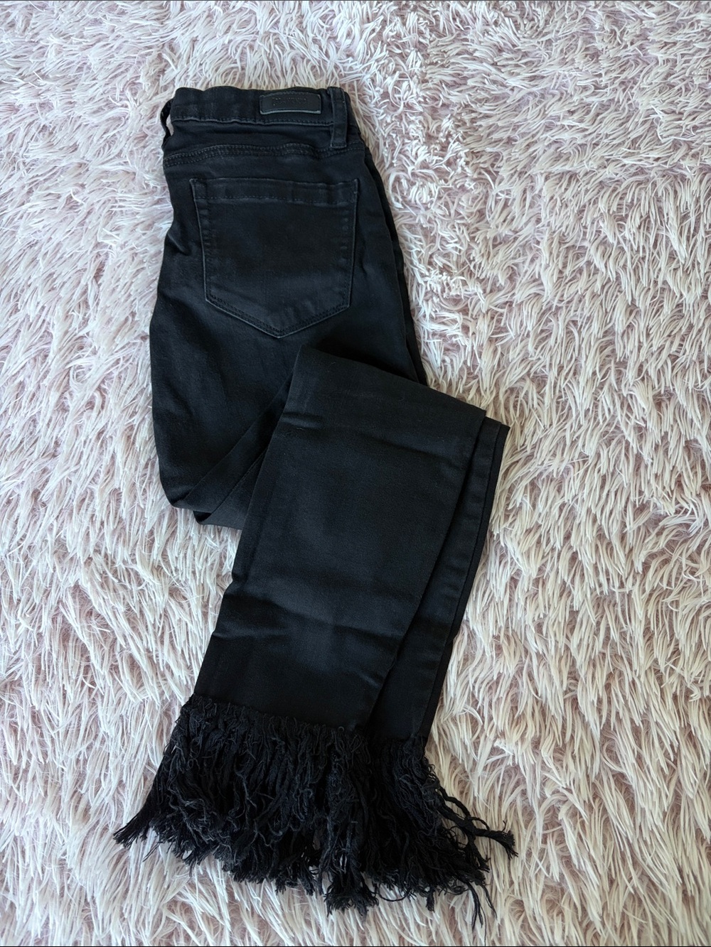 Blank NYC Black Flared Jeans with Fringe Hem